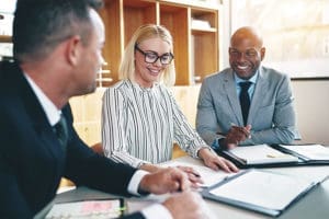 Risk-Management-Insurance-Advisor-Examining-Different-Risk-Options-in-an-Upscale-Office-Setting